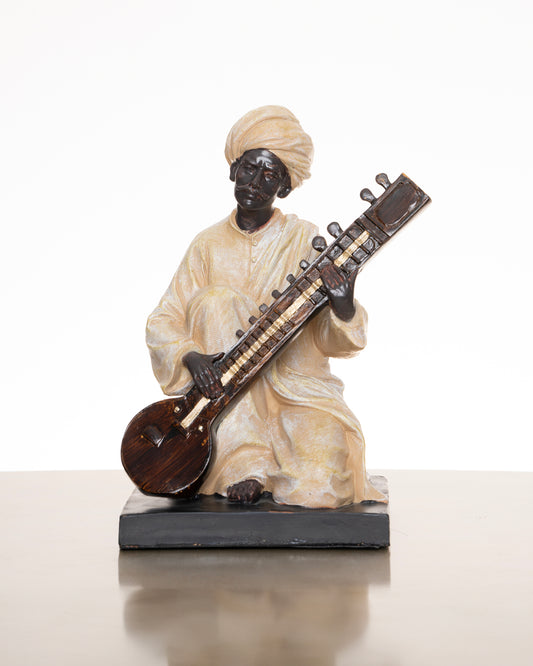 Indian Man Playing music instrument figurine